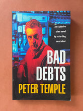 Load image into Gallery viewer, Bad Debts by Peter Temple: photo of the front cover which shows very minor scratching, and obvious creasing on the bottom-left corner.
