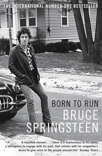 Born to Run by Bruce Springsteen: stock image of front cover which shows a young Bruce Springsteen leaning against a car in front of a suburban home.
