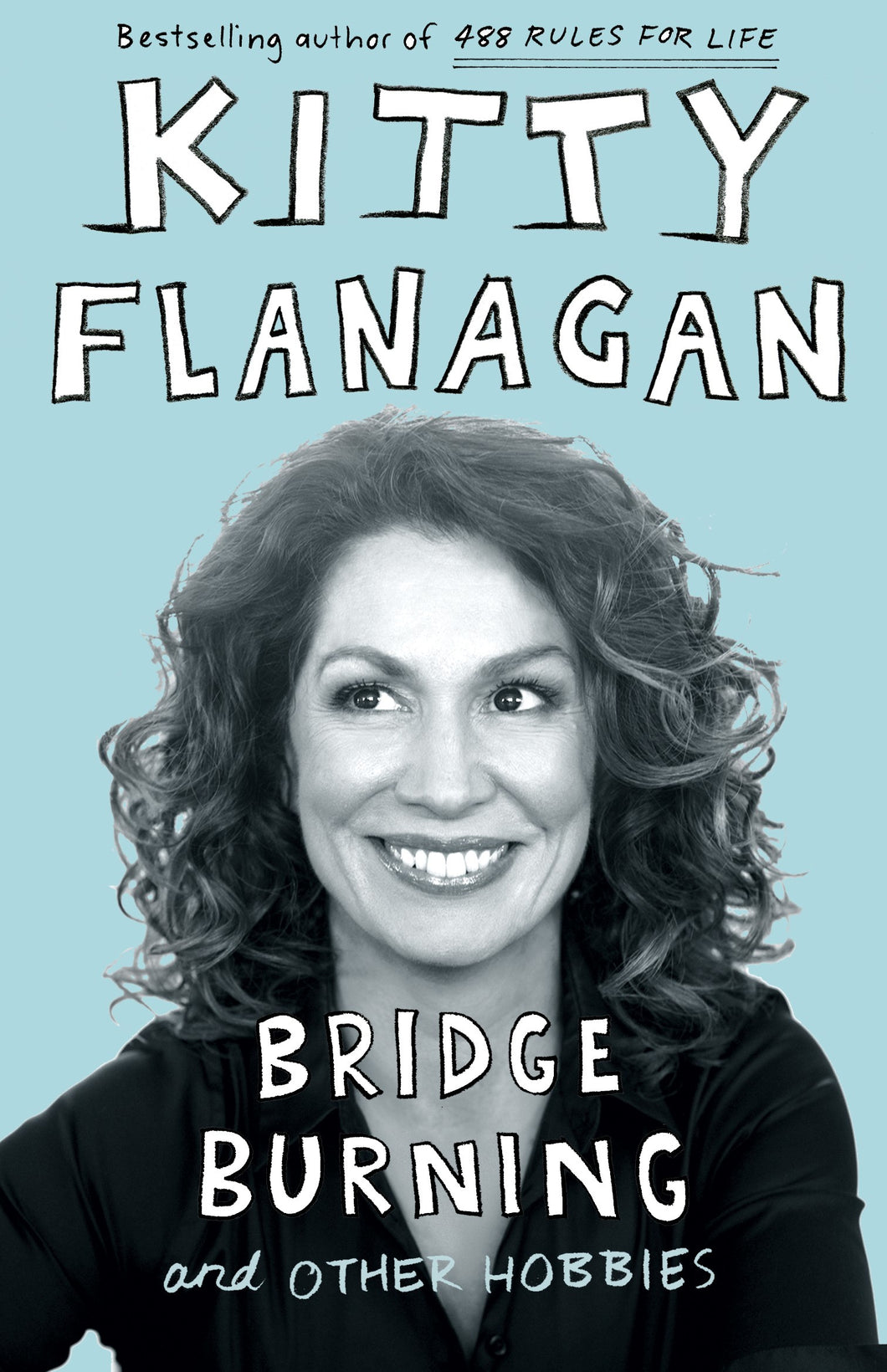 Book cover for 'Bridge Burning and Other Hobbies' by Kitty Flanagan featuring a woman with text.