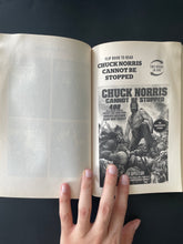 Load image into Gallery viewer, Chuck Norris VS. Mr. T by Ian Spector: photo of unnumbered page in book which shows a wavey wrinkling.
