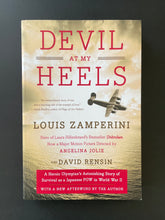 Load image into Gallery viewer, Devil at My Heels by Louis Zamperini: photo of the front cover which shows a very, very minor crease on the bottom-right corner.
