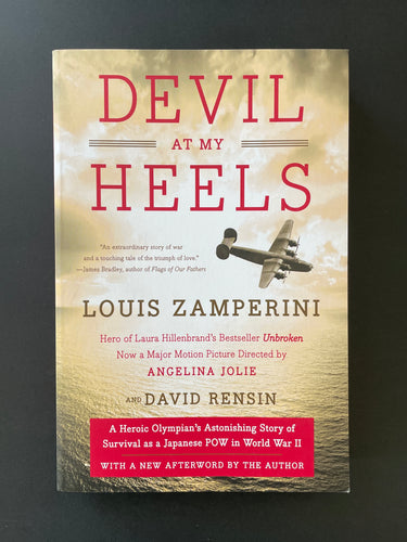 Devil at My Heels by Louis Zamperini: photo of the front cover which shows a very, very minor crease on the bottom-right corner.