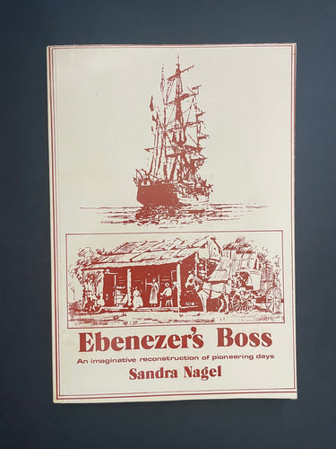 Book cover of 'Ebenezer's Boss' by Sandra Nagel with ship and pioneer village illustration on a dark background. The photo shows very minor scuff marks along the edges.