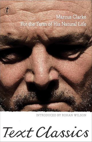 Book cover of 'For the Term of His Natural Life' by Marcus Clarke, featuring a close-up of a man's face.