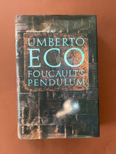 Load image into Gallery viewer, Foucault&#39;s Pendulum by Umberto Eco: photo of the front cover which shows minor scuff marks along the edges of the dust jacket.
