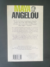 Load image into Gallery viewer, Gather Together in My Name by Maya Angelou: photo of the back cover which shows very minor scuff marks along the edges.
