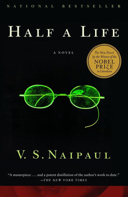 Book cover of 'Half a Life' by V.S. Naipaul with green eyeglasses on a black background.