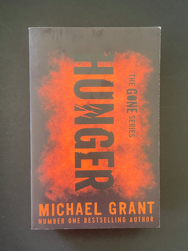 Hunger by Michael Grant: photo of the front cover which shows very, very minor scuff marks along the edges.