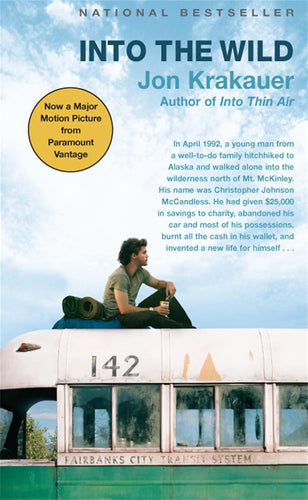 Book cover of 'Into the Wild' by Jon Krakauer with a person sitting on a train car.