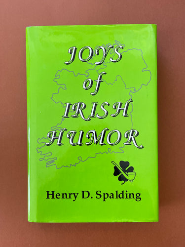 Joys of Irish Humor by Henry D. Spalding: photo of the front cover which shows very minor scuff marks along the edges of the dust jacket.