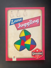 Load image into Gallery viewer, Front cover of 'Learn Juggling by Jaclyn Crupi', featuring a beige background with a red border, blue and pink title banners, and an illustration of three colourful juggling balls. Shows very minor, tiny, scuff marks along the edges.
