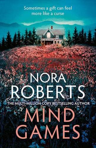 Book cover of 'Mind Games' by Nora Roberts with a house in a field of flowers and mountains in the background.