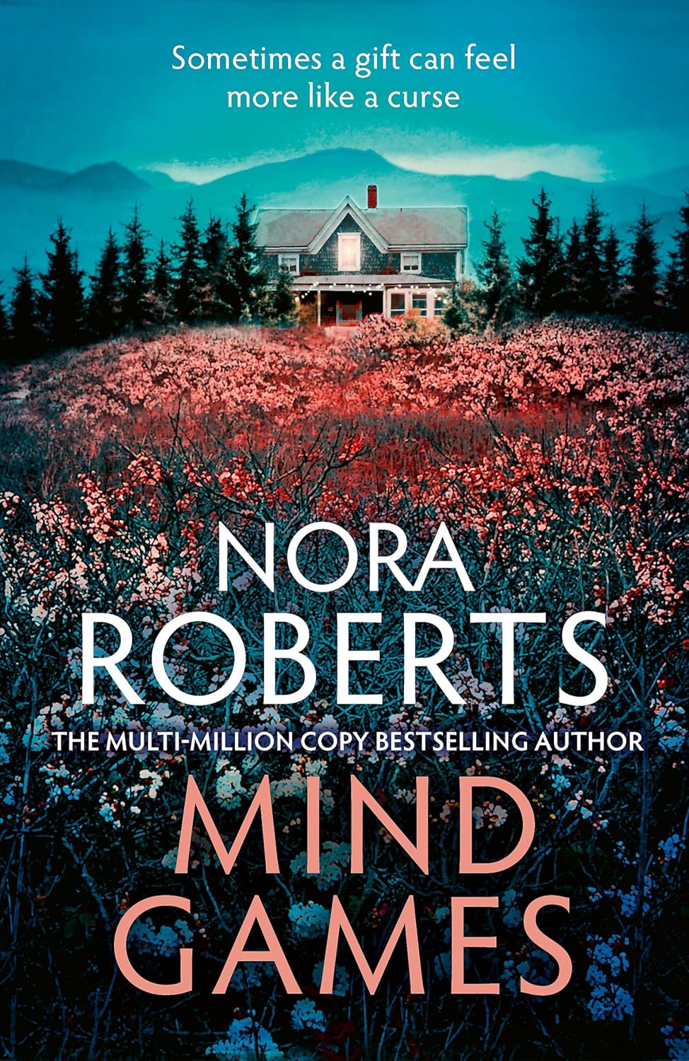 Book cover of 'Mind Games' by Nora Roberts with a house in a field of flowers and mountains in the background.