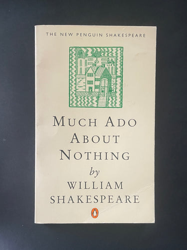 Book cover of 'Much Ado About Nothing' by William Shakespeare with a green decorative design on a dark background. Some creasing on the top-right corner, and an obvious crease on the bottom-right corner.