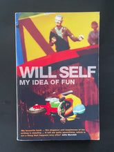 Load image into Gallery viewer, Book cover of &#39;My Idea of Fun&#39; by Will Self with colourful illustration on a dark background. The photo shows minor scuff marks along the edges.
