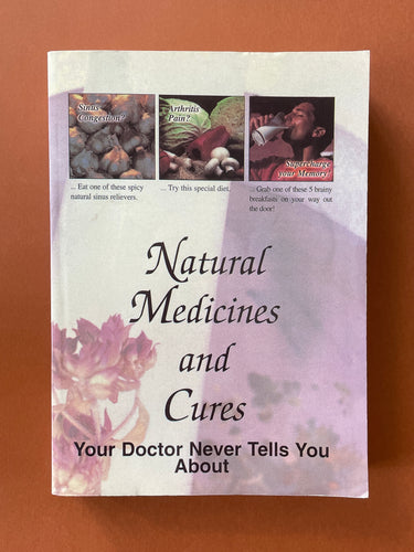 Natural Medicines and Cures by FC&A: photo of the front cover which shows minor scuff marks, creasing and scratches.