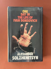 Load image into Gallery viewer, One Day in the Life of Ivan Denisovich: photo of the front cover which shows scuff marks and creasing.
