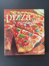 Load image into Gallery viewer, Pizza-And Other Savory Pies by Brigit Binns: photo of the front cover which shows very minor scuff marks along the edges.
