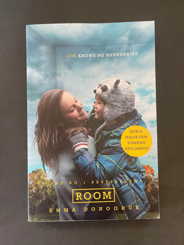 Book cover of 'Room' by Emma Donoghue featuring a woman and child against a sky background. Very minor scuff marks along the edges.