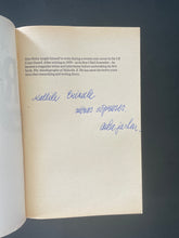 Load image into Gallery viewer, Roots by Alex Haley: photo of the first page which has been inscribed in blue pen. No other writing in the margins anywhere else in the book.
