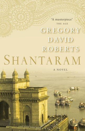 Book cover of 'Shantaram' by Gregory David Roberts with a golden gate and river scene.
