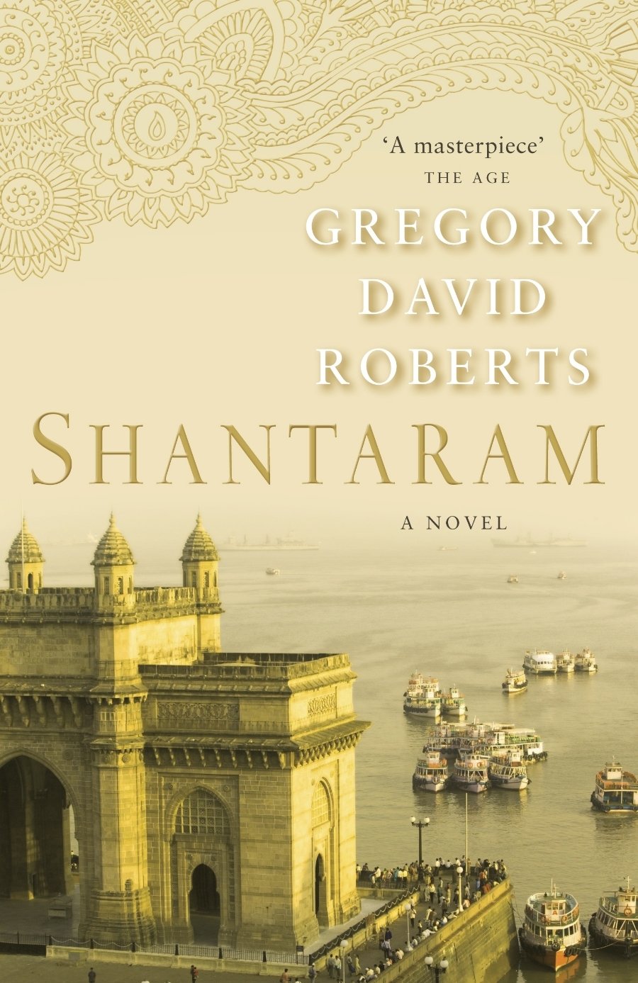 Book cover of 'Shantaram' by Gregory David Roberts with a golden gate and river scene.