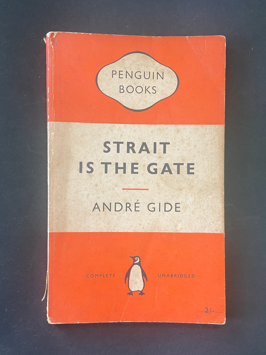 Strait is the Gate by Andre Gide: photo of the front cover which shows scuff marks, creasing, discolouring, and general wear and tear.