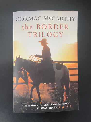 The Border Trilogy by Cormac McCarthy: photo of the front cover which shows very minor scuff marks along the edges.