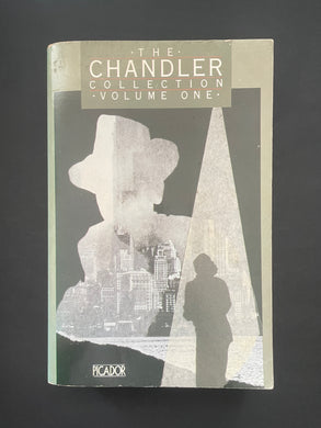 Book cover of 'The Chandler Collection Volume One' by Raymond Chandler with a silhouette design on a dark background. The photo shows minor scuff marks and scratching, and a minor crease on the bottom-right corner.