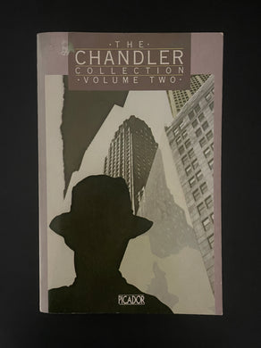 Book cover of 'The Chandler Collection Volume Two' with a silhouette of a person and cityscape. The photo shows tiny scuff marks along the edges; a very minor crease on the bottom-right corner; and a small blob of discolouring on the top-left corner.