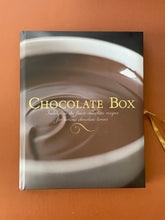 Load image into Gallery viewer, The Chocolate Box by Fiona Roberts: photo of the front cover which shows very minor (barely noticeable) scuff marks along the edges.
