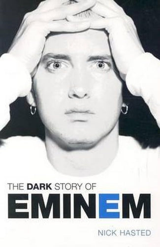 Book cover of 'The Dark Story of Eminem' by Nick Hasted with a black and white photo of Eminem.