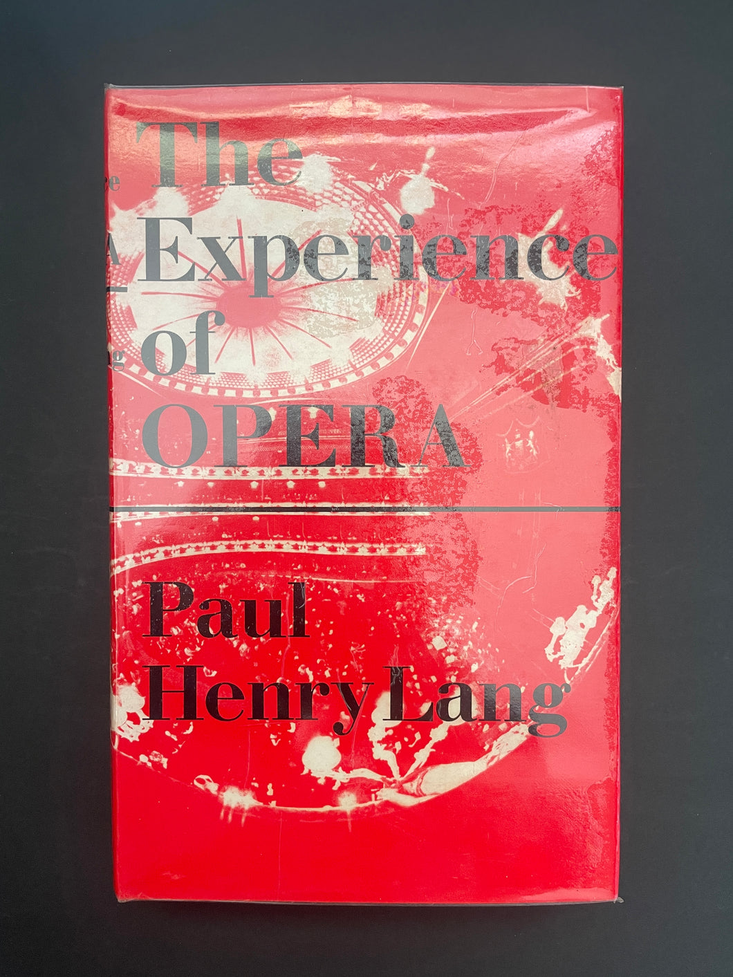 The Experience of Opera by Paul Henry Lang: photo of the front cover which shows air pockets under the clear plastic dust jacket.