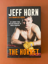 Load image into Gallery viewer, The Hornet by Jeff Horn: photo of the front cover which shows minor, but obvious, scuff marks along the edges of the dust jacket.
