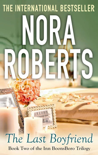 Book cover of 'The Last Boyfriend' by Nora Roberts with a blurred background