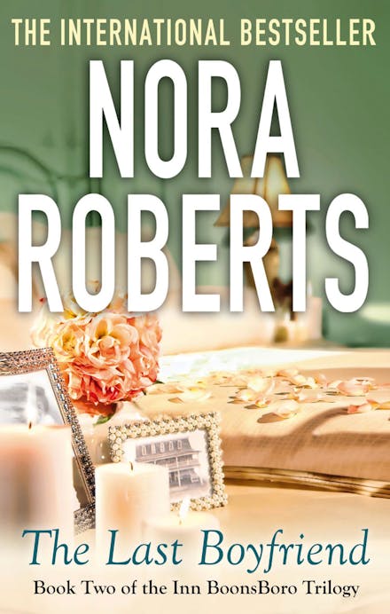 Book cover of 'The Last Boyfriend' by Nora Roberts with a blurred background
