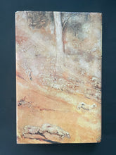 Load image into Gallery viewer, The Man from Snowy River and Other Verses by A. B. Paterson: photo of the back cover which shows minor scuff marks along the edges of the dust jacket.
