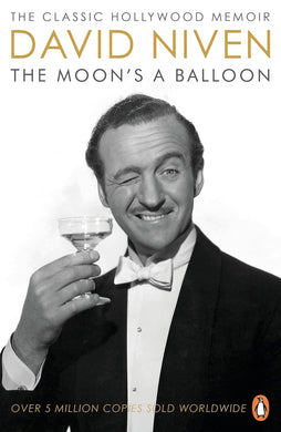 Book cover of  'The Moon's a Balloon' by David Niven featuring a black and white photo of David Niven in a tuxedo holding a a martini glass.