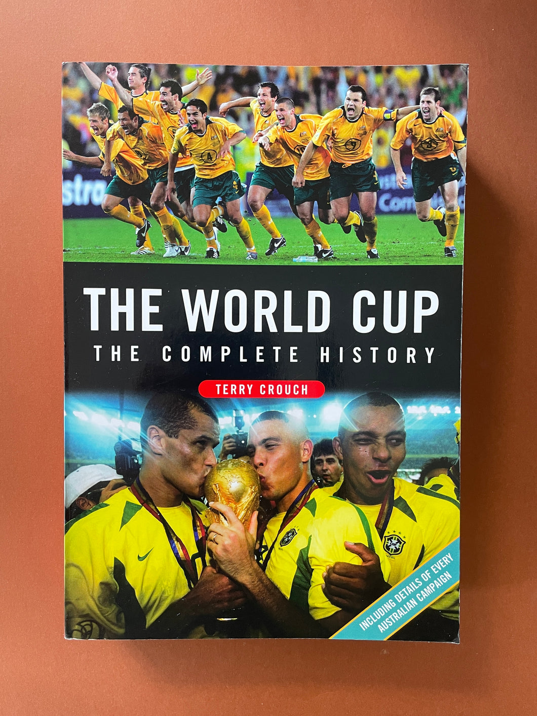 The World Cup-The Complete History by Terry Crouch: photo of the front cover which shows very minor scuff marks and creasing.