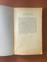 Load image into Gallery viewer, Three Men in a Boat by Jerome K. Jerome:photo of the first page which shows blotches of discolouring, and creasing.
