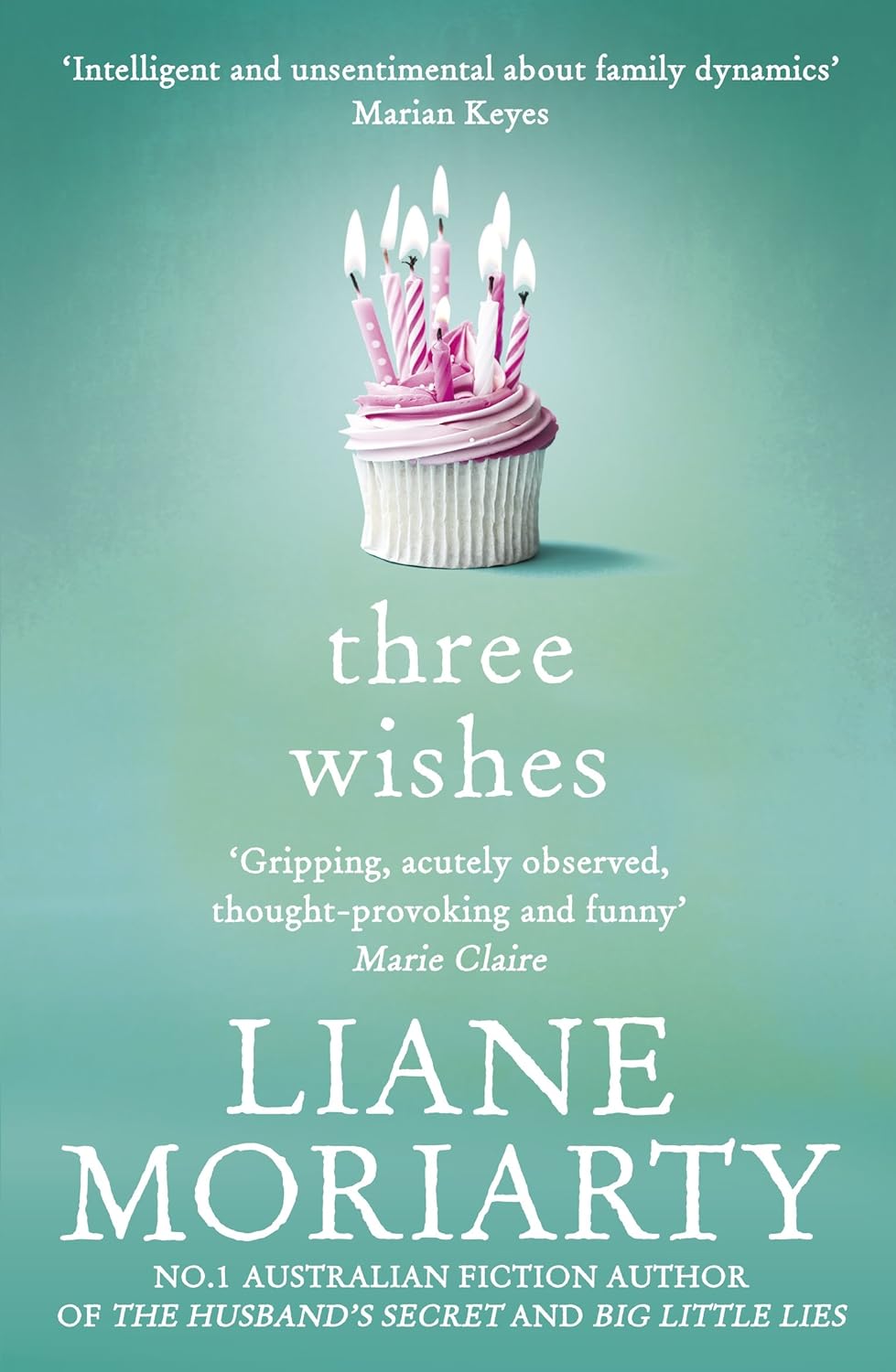 Book cover of 'Three Wishes' by Liane Moriarty with a cupcake and candles on a green background