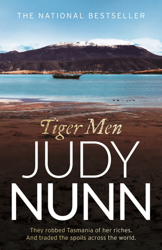 Book cover of 'Tiger Men' by Judy Nunn with a scenic background of a lake and mountains.