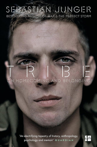 Book cover of 'Tribe' by Sebastian Junger featuring a close-up of a soldier's face.