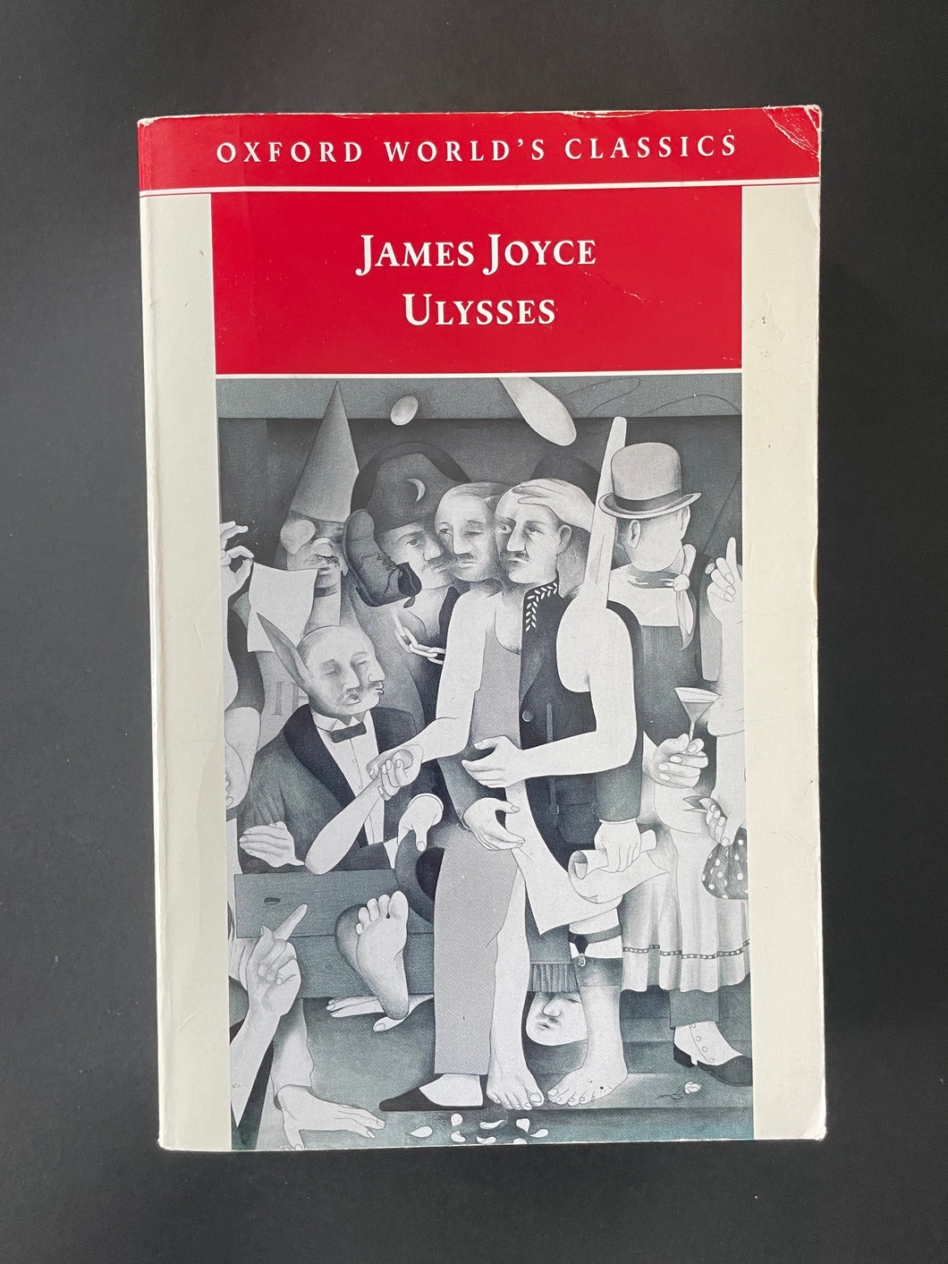 Ulysses by James Joyce: photo of the front cover which shows some creasing and minor scuff marks.