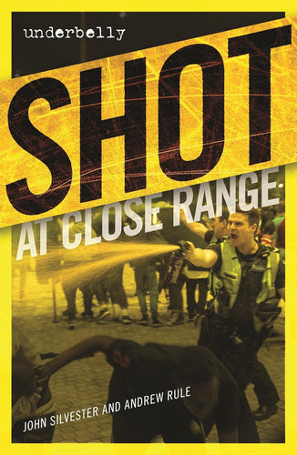 Book cover of 'Shot at Close Range' by John Silvester and Andrew Rule with a yellow border and black text.