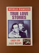 Load image into Gallery viewer, World Famous-True Love Stories by Colin &amp; Sally Wilson: photo of the front cover which shows minor creasing and scratches. and very minor scuff marks.
