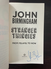 Load image into Gallery viewer, Stranger Thingies by John Birmingham book: photo of title page with the author&#39;s signature in blue pen.
