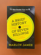 Load image into Gallery viewer, A Brief History of Seven Killings by Marlon James: photo of the front cover which shows very minor (barely visible) scuff marks along the edges.

