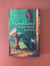 Load image into Gallery viewer, A Good Land by Nada Awar Jarrar: photo of the front cover which shows very minor (barely visible) scuff marks along the edges.
