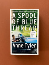 Load image into Gallery viewer, A Spool of Blue Thread by Anne Tyler: photo of the front cover which shows very minor scuff marks along the edges.
